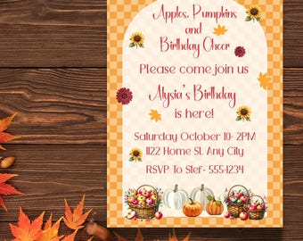 May include: A seasonal birthday invitation with the text "Apples, Pumpkins and Birthday Cheer." The design includes sunflowers, autumn leaves, and illustrations of pumpkins and apple baskets. The background has a checkered pattern.