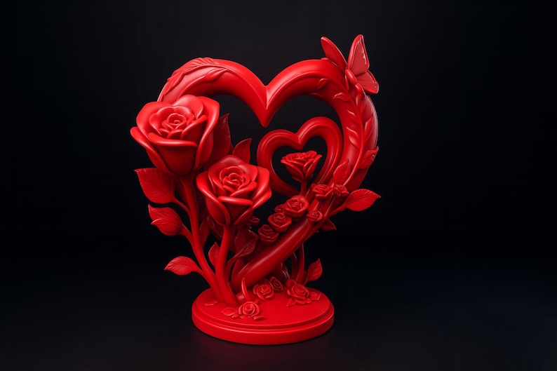 May include: A vibrant red heart-shaped sculpture with roses and a butterfly. The sculpture features three large roses, smaller roses, and a butterfly accent. The design includes a heart within a heart, all on a round base.