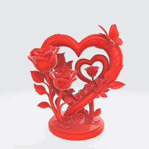May include: A red decorative sculpture featuring a heart-shaped frame with a smaller heart inside. Roses and leaves are arranged around the heart, and a butterfly sits atop the frame. The sculpture is on a round base.