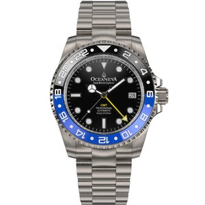 May include: A stainless steel wristwatch with a black dial and blue and black bezel. The watch features a date display and the text "OCEANEVA Deep Marine Explorer". The watch band is also stainless steel.