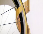 Bamboo Bike Rack - Hang your bikes vertically with sustainable style. Essence of simplicity, hand carved from 1 piece.