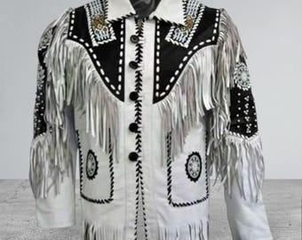 May include: White leather jacket with black detailing, fringe, and decorative beading. The jacket has a collared neckline, button-up front, and detailed stitching. The sleeves and chest have fringe detailing.