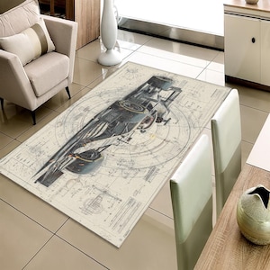 May include: A rectangular area rug featuring a detailed blueprint design with a central illustration of a futuristic spacecraft. The rug's color palette includes beige, gray, and black, creating a vintage aesthetic. The rug is placed on a tiled floor.