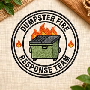 May include: A circular embroidered patch featuring a green dumpster on fire. The text DUMPSTER FIRE is arched across the top and RESPONSE TEAM is arched across the bottom in black thread. Two small orange and yellow flames flank the center.