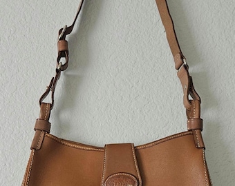 Vintage Dooney & Bourke Donegal crest shoulder bag with matching wallet.