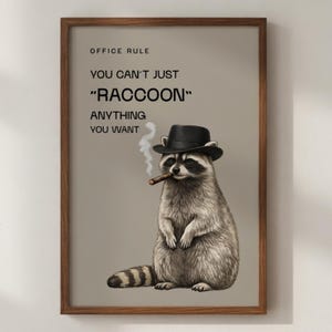 May include: A framed print showing a raccoon in a black fedora smoking a cigar. The text above the raccoon reads "OFFICE RULE YOU CAN'T JUST 'RACCOON' ANYTHING YOU WANT."