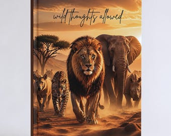 May include: A hardcover book featuring a sunset savanna scene with a lion, elephant, leopard, and rhinoceros. The text "wild thoughts allowed" is printed in black cursive script across the top against a warm orange and yellow sky background.
