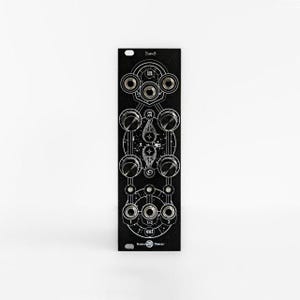 May include: Black electronic module with silver knobs and ports. The module has white graphic designs and text, including "IN" and "OUT". The text "Pans S" is at the top. The module is rectangular and has a series of circular knobs and ports.