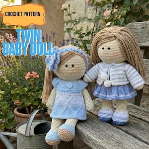 May include: Two handmade crochet baby dolls. One doll wears a blue dress and a matching headband. The other doll wears a blue and white striped sweater and a blue skirt. The dolls have tan yarn hair and are sitting on a wooden bench. The text "CROCHET PATTERN" and "TWIN BABY DOLL" are visible.