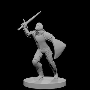 May include: A grey figurine of a knight in full armour, holding a sword aloft and a shield at his side. The knight is posed in a dynamic stance, as if in battle. The figurine is set on a circular base against a black background.