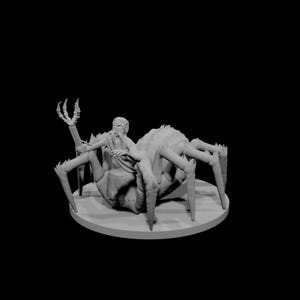 May include: A grey 3D-printed figurine depicting a humanoid figure riding a large spider. The spider has multiple legs and a textured body. The humanoid figure is seated on the spider's back, with one arm raised. The figurine is on a round base.