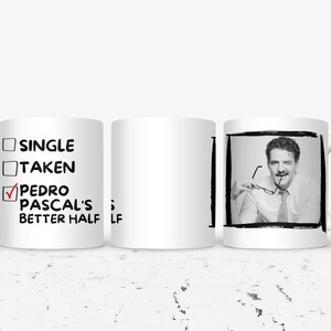 May include: White ceramic mug with a black and white image of a man holding glasses. The mug has the text "SINGLE", "TAKEN", and "PEDRO PASCAL'S BETTER HALF" with a checkmark next to the last option.