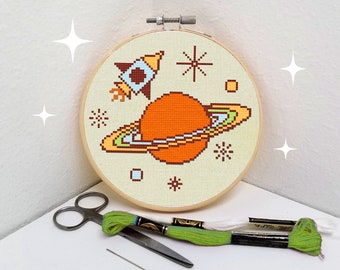 Outer space cross stitch pattern Saturn rocket ship, planets and stars easy beginner embroidery download by Mid Century Maude