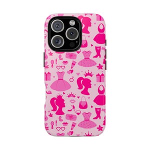 May include: Pink phone case with a repeating pattern of princess-themed silhouettes. The design includes dresses, crowns, purses, high heels, and other accessories. The case has a black camera module.