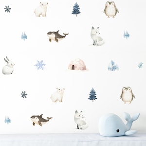 May include: Watercolor wall decals featuring arctic animals including polar bears, penguins, foxes, and whales. The set includes an igloo, snowflakes, and evergreen trees in soft watercolor hues. Perfect for a nursery or children's room.