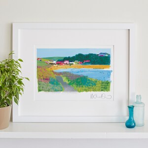 May include: A framed illustration of a beach scene with colorful houses, a sandy beach, and blue water. The illustration is signed "Waldo" in the bottom right corner.