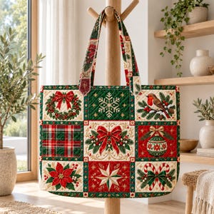 May include: A quilted tote bag featuring a patchwork design with Christmas motifs including a wreath, snowflake, robin, plaid pattern, red bow, ornament, poinsettia, star, and candy canes in shades of red, green, white, and gold.