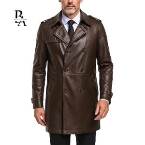 May include: A brown leather double-breasted trench coat. The coat has a notched collar, shoulder epaulettes, and a double-breasted button closure. The coat has a tailored fit and is made of a smooth, shiny leather material. A classic outerwear garment.