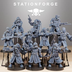 May include: A collection of gray miniature figurines of soldiers, each equipped with gas masks, rifles, and winter coats. The figurines are arranged on a black platform. The text "STATIONFORGE" and a skull logo are visible.