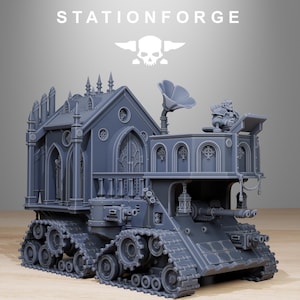 May include: A gray, detailed model of a tank-like vehicle with a church-like structure on top. The model features intricate architectural details, a large speaker, and the text "STATIONFORGE".