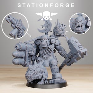 May include: A gray, detailed miniature figure of an orc-like warrior, holding a large weapon and a spiked hammer. The figure has a menacing expression and is accompanied by a small creature. The text "STATIONFORGE" is at the top.
