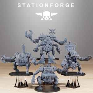 May include: Five gray miniature robot figures with intricate mechanical details are displayed on clear stands. The figures have various armaments and designs, with the text "STATIONFORGE" and a skull logo at the top.