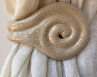Handcrafted ceramic swirl curtain tieback - wall tieback in speckled glazed stoneware, snail shape - made in France