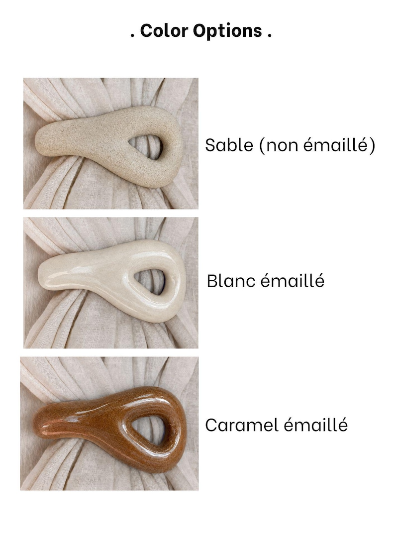 May include: Three teardrop-shaped ceramic napkin rings shown in different finishes. The top is matte beige, the middle is glossy off-white, and the bottom is glossy caramel brown. Each ring is displayed over a light beige fabric napkin.