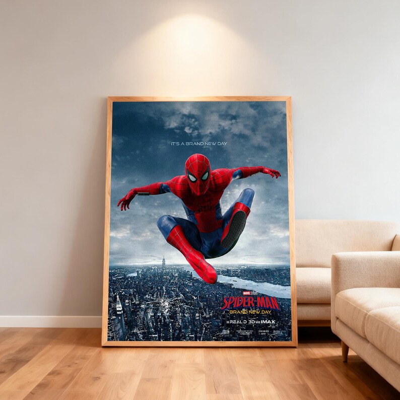 May include: A framed poster for the film Spider-Man, showing the superhero in a red and blue suit, leaping over a city. The poster has a wooden frame and includes the text "SPIDER-MAN BRAND NEW DAY" and "REALD 3D IMAX". The background is a cityscape.