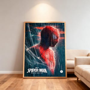 May include: A framed poster of Spider-Man, depicted in his red and black suit, with a detailed rendering of his face and costume. The poster features the text "SPIDER-MAN BRAND NEW DAY" at the bottom, set against a rainy, web-filled backdrop.