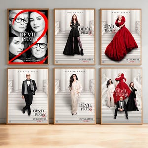 May include: Six framed movie posters for "The Devil Wears Prada" are displayed. The posters feature images of the cast, including Meryl Streep, Anne Hathaway, and Emily Blunt. The movie title and release date are also visible.