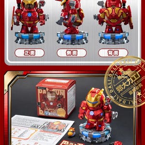 May include: A red and gold Iron Man-style toy robot, displayed with a three-view drawing. The toy is on a blue-lit base, with accessories and packaging. The box features the text "DA LI".