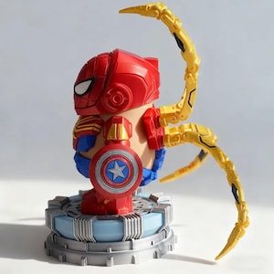May include: A red and gold Spider-Man figure with a Captain America shield. The figure has articulated gold arms and is standing on a blue and gray platform. The figure's head is red with white eye details.