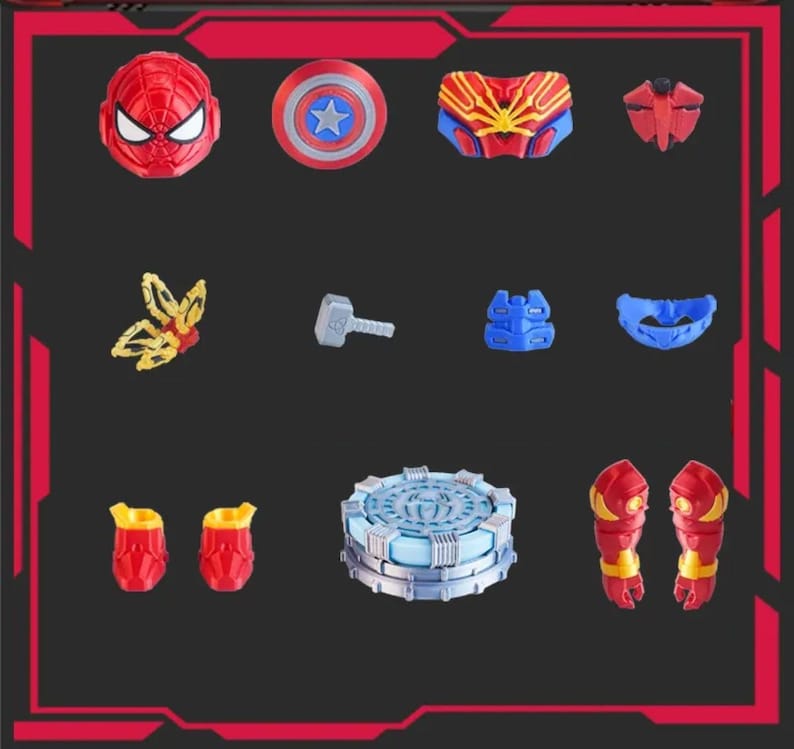 May include: A collection of superhero-themed toys and accessories, including a red Spider-Man mask, Captain America shield, and various armor pieces. The items are arranged on a dark background within a red-lined frame.