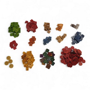 May include: A collection of colorful game pieces, including green, red, orange, blue, and brown shapes. The pieces are various shapes, including squares, circles, and tokens, with etched symbols. The pieces are arranged on a white background.