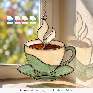 May include: A stained glass suncatcher shaped like a coffee cup and saucer with a green and cream finish, featuring dark brown liquid and white steam rising from the top. The piece hangs from a metal chain and includes SVG, PDF, JPG, and PNG icons.