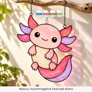 May include: A stained glass suncatcher shaped like a pink axolotl with purple and red gills, a cream-colored belly, and a curved tail. The piece hangs from a metal chain and includes digital file icons labeled SVG, PDF, JPG, and PNG above it.