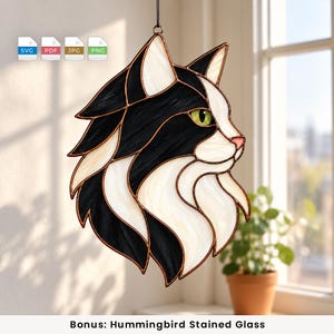 May include: A stained glass suncatcher shaped like a cat head in profile, featuring black and white glass segments joined by copper foil lines. The cat has a single visible green eye and a pink nose. Four file format icons are visible above.