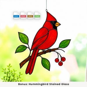 May include: A stained glass cardinal bird suncatcher featuring vibrant red glass, a black face mask, and an orange beak. The bird is perched on a brown branch with green leaves and red berries. Includes SVG, PDF, JPG, and PNG file icons.