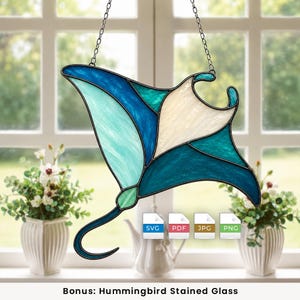 May include: A stained glass manta ray suncatcher featuring shades of blue, teal, and white glass pieces joined by dark metal lines. The piece hangs from a metal chain and includes digital file icons labeled SVG, PDF, JPG, and PNG.