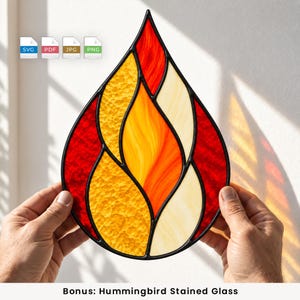 May include: A teardrop-shaped stained glass suncatcher featuring a flame-like design with textured red, orange, yellow, and cream glass segments outlined in black metal. The piece includes digital file icons labelled SVG, PDF, JPG, and PNG.