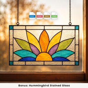 May include: A rectangular stained glass panel featuring a central sunburst design with yellow, orange, purple, green, teal, and blue glass segments. The piece is framed in black metal and suspended by two chains. Icons for SVG, PDF, JPG, and PNG are visible.