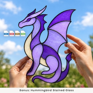 May include: A stained glass dragon suncatcher featuring shades of purple and cream glass pieces held together by black metal lines. The design includes a long tail, large wings, and a pointed head. Four file format icons labelled SVG, PDF, JPG, and PNG.