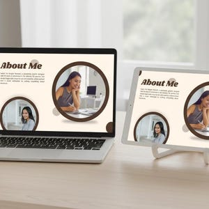 May include: A laptop and tablet displaying a webpage titled "About Me." The webpage features a photo of a woman in a circular frame, along with text. A pen, notepad, and pencils are on the desk.