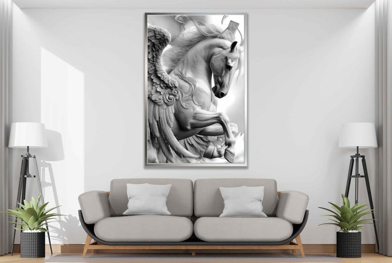 May include: Black and white framed artwork of a Pegasus, a mythical winged horse. The sculpture-like image features detailed wings and a rearing pose. The artwork is displayed above a gray sofa with white pillows, enhancing the room's decor.