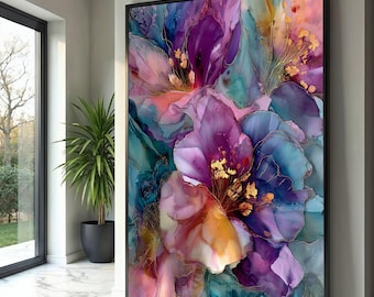May include: Abstract floral art print in a black frame. The artwork features a close-up of a flower with vibrant colors, including purple, blue, pink, and gold accents. The petals have a watercolor effect, creating a soft and dreamy aesthetic.
