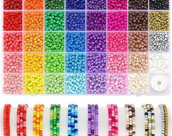 May include: A clear plastic organizer filled with small, colorful beads in various shades, including red, orange, green, blue, and purple. Below, several beaded bracelets in coordinating colors are displayed, showcasing the beads' versatility for jewelry making.