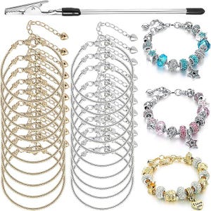 May include: An assortment of charm bracelets in gold and silver, with various decorative beads and charms. The image also includes a silver-colored jewelry tool with a clamp at one end.
