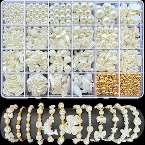 May include: A clear plastic organizer filled with various ivory-colored beads and charms, including pearls, shells, stars, and flowers. Below, several pearl bracelets with gold accents and decorative charms are displayed.