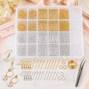 May include: A clear plastic organizer filled with various jewelry-making supplies. The kit includes gold and silver-colored earring hooks, head pins, eye pins, jump rings, and other components. The image also shows finished earrings and a pair of tweezers.